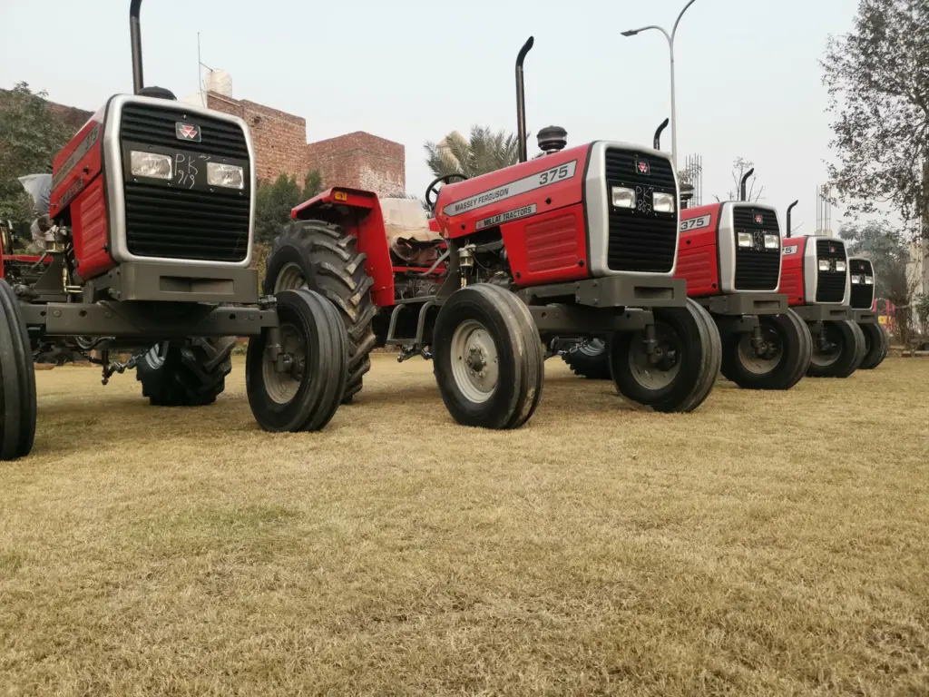 MF 375 tractors lined up for export preparation